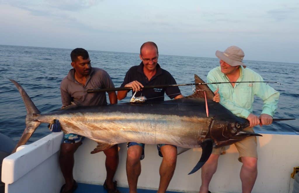 Black marlin caught deep sea fishing saltwater spinning reel