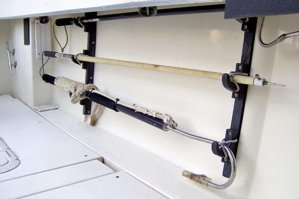 Fishing rod racks on a fishing boat stow gaffs, tagging stick