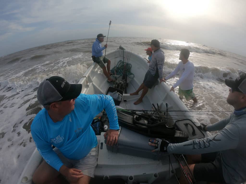 Launching a panga into the surf