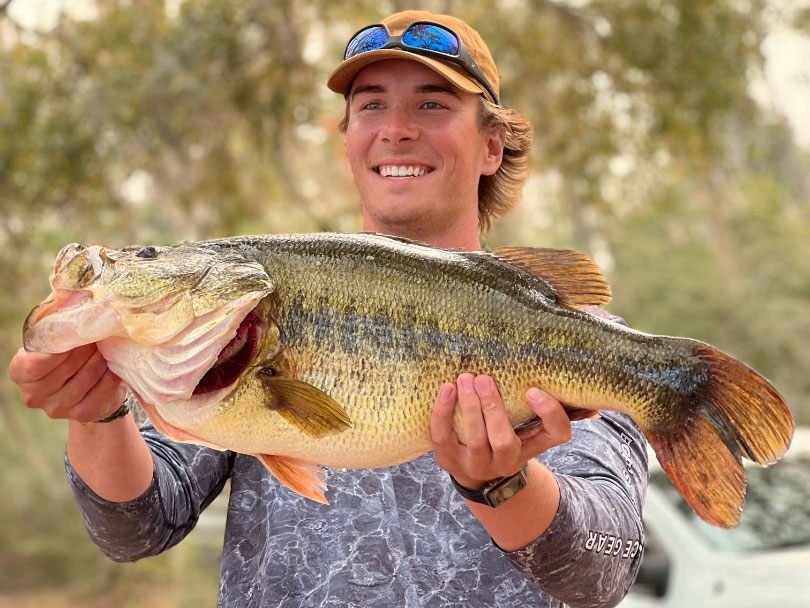 Largemouth bass held up by angler