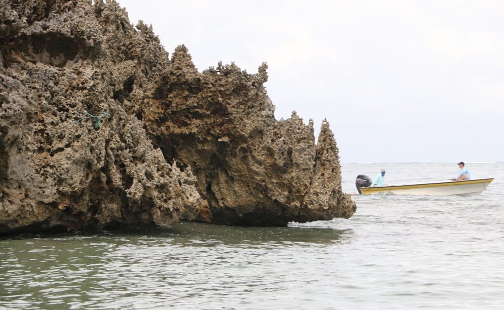 Anglers fish along unusual jagged shoreline on Roatan Island